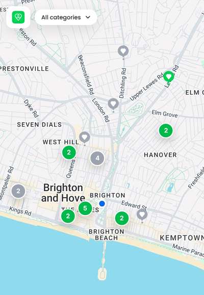 Screenshot of the OffersOn consumer map showing green pins and clusters of offers across central Brighton and Hove