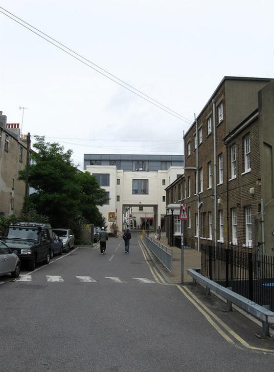 Barrack Yard in Brighton’s North Laine looking towards North Road, with the brick Old Slipper Baths building on the right and parked cars on the left