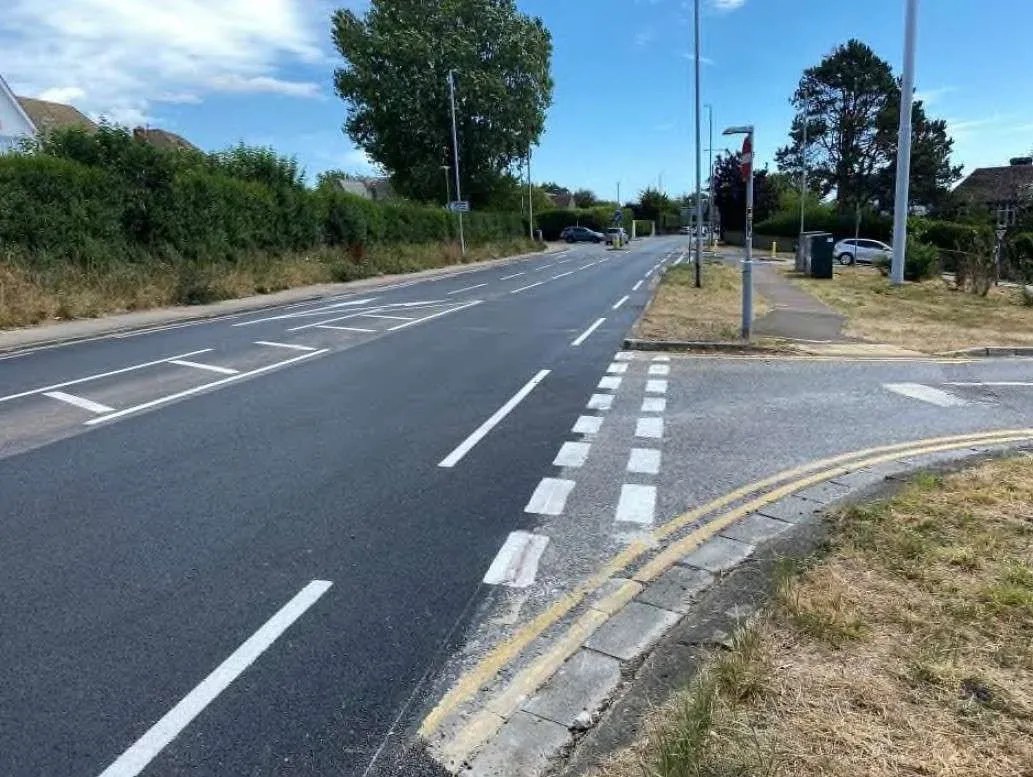 Shirley Road in Hove after micro-asphalt resurfacing, showing a smooth new road surface with fresh white lane markings