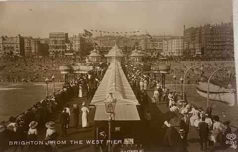 Postcard of crowds on the West Pier deck