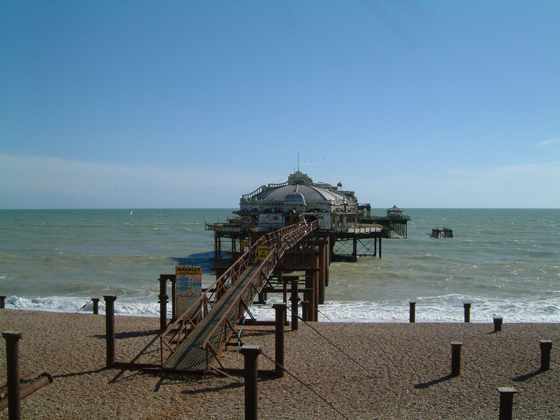 The West Pier and its walkway from the beach in 2002