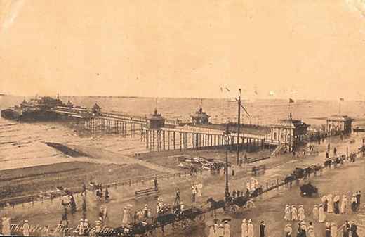 Sepia postcard of the West Pier and the seafront