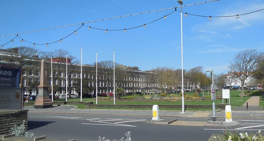 Steyne Gardens in Worthing with the obelisk and the Georgian terrace behind, shown without the ice rink