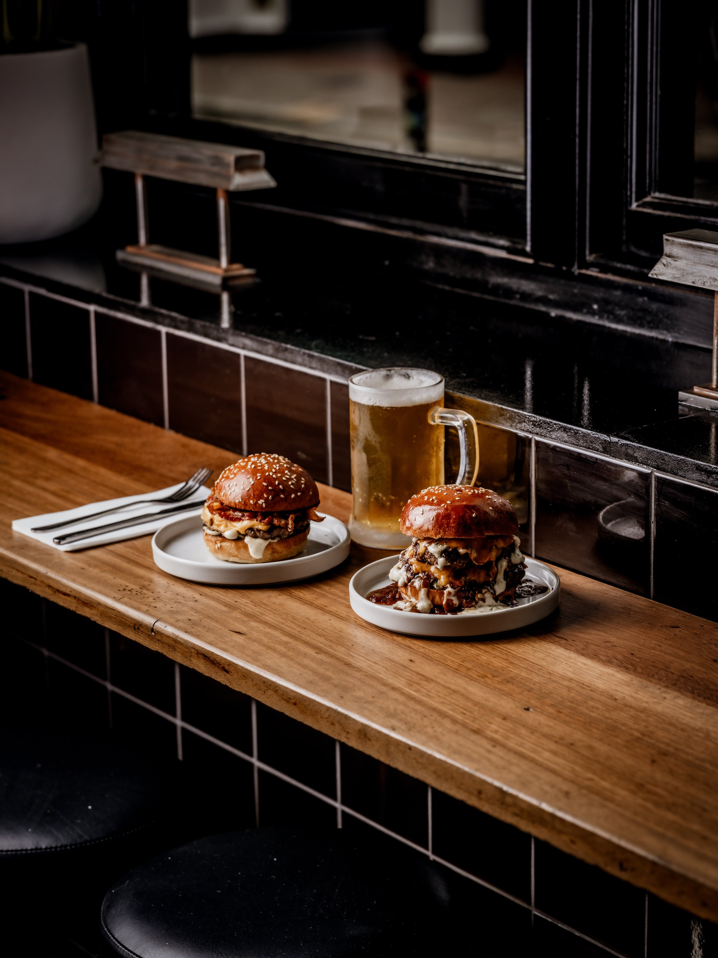 Burgers and drinks served inside the new Burger & Beyond restaurant in Brighton. Photo: Burger & Beyond