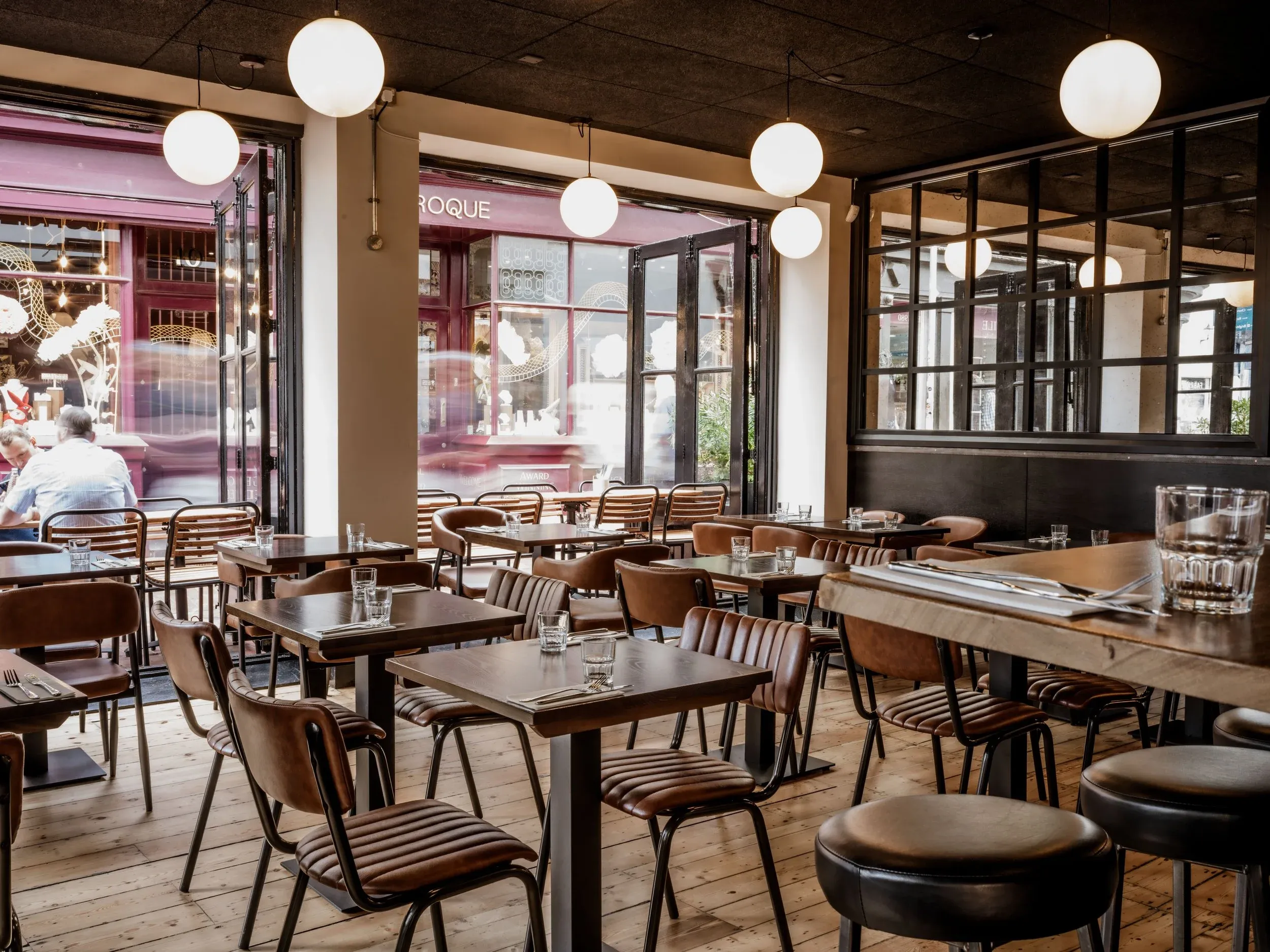 Interior of the Burger & Beyond restaurant on Ship Street in Brighton, showing the dining area and seating