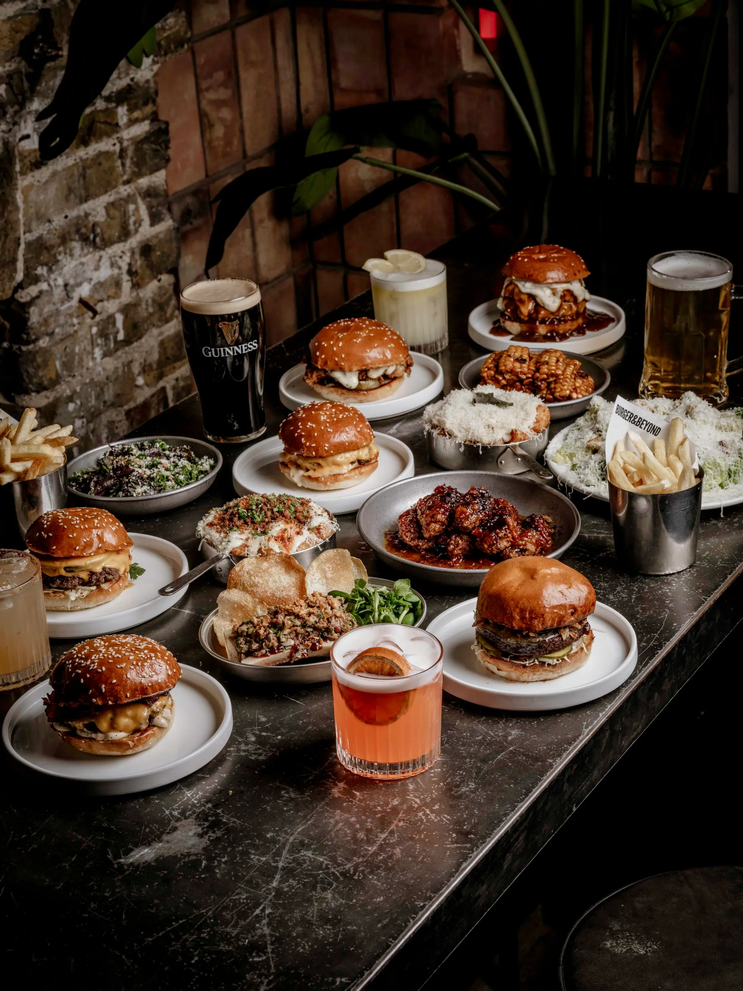 A selection of Burger & Beyond menu items including burgers, fries, chicken wings, sides and drinks at the Brighton restaurant